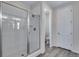 Elegant bathroom featuring a glass enclosed shower with tiled walls and floor at 944 Alpine Ridge St, Erie, CO 80516