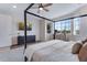 Bright bedroom with large windows and a bed, providing a relaxing retreat at 944 Alpine Ridge St, Erie, CO 80516