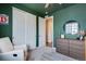 Bedroom with closet, dresser and accent wall paint at 944 Alpine Ridge St, Erie, CO 80516