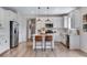 Modern kitchen featuring stainless steel appliances, a center island, and pendant lighting at 944 Alpine Ridge St, Erie, CO 80516