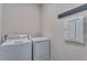 Laundry room with side by side washer and dryer at 944 Alpine Ridge St, Erie, CO 80516