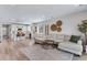 Bright open-concept space with modern furnishings connecting living room and kitchen at 944 Alpine Ridge St, Erie, CO 80516