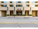 Modern building exterior with glass entryway and street-level access at 1700 Bassett St # 406, Denver, CO 80202