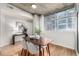 Dining area with concrete accents, large windows, and modern dining set at 1700 Bassett St # 406, Denver, CO 80202