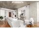 Well-lit living room with modern furniture, hardwood floors, and concrete ceilings at 1700 Bassett St # 406, Denver, CO 80202