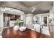 Open floor plan with a dining room, kitchen, and living room with hardwood floors at 1700 Bassett St # 406, Denver, CO 80202