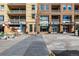 Street view of retail storefronts and apartment complex at 1700 Bassett St # 406, Denver, CO 80202