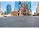Urban street view featuring modern buildings and pedestrian walkways at 1700 Bassett St # 406, Denver, CO 80202