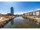 Breathtaking view of water and bridge, with walking paths along the shoreline for outdoor enjoyment at 1700 Bassett St # 406, Denver, CO 80202