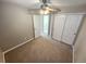 Bedroom with carpet, ceiling fan, and double door closet at 3747 Windriver Trl, Castle Rock, CO 80109