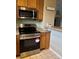 Updated kitchen features stainless appliances including range and microwave at 3747 Windriver Trl, Castle Rock, CO 80109
