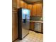 An updated kitchen offers stainless steel appliances and solid oak cabinetry at 3747 Windriver Trl, Castle Rock, CO 80109