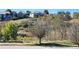 View of neighborhood, homes, and landscaping at 3747 Windriver Trl, Castle Rock, CO 80109