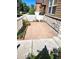 Tiled patio with a white fence, bordered by garden beds, offering a private outdoor space at 3747 Windriver Trl, Castle Rock, CO 80109