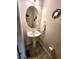 This half bath has a pedestal sink, decorative mirror, and neutral decor at 3747 Windriver Trl, Castle Rock, CO 80109