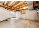 Unfinished basement with concrete floor and white-painted walls, ready for customization at 5660 S Algonquian Way # C, Aurora, CO 80016