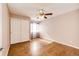 The bedroom has a ceiling fan, closet with sliding doors, and wood floors at 5660 S Algonquian Way # C, Aurora, CO 80016