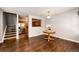 Cozy dining area with hardwood floors, natural light, and a view to the staircase and kitchen at 5660 S Algonquian Way # C, Aurora, CO 80016