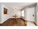 Inviting dining area with hardwood floors, natural light, and easy access to the adjacent kitchen at 5660 S Algonquian Way # C, Aurora, CO 80016