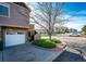 Townhome exterior with attached garage, landscaped front yard, and street parking at 5660 S Algonquian Way # C, Aurora, CO 80016
