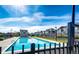 Community pool with clear blue water, surrounded by fencing and nearby townhomes at 5660 S Algonquian Way # C, Aurora, CO 80016