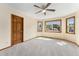 Bedroom with large windows and soft carpet at 6323 S Sicily Way, Aurora, CO 80016