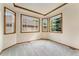 Cozy bedroom featuring large bay windows and neutral carpet at 6323 S Sicily Way, Aurora, CO 80016