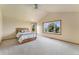 Inviting bedroom featuring a ceiling fan and generous natural light from large windows at 6323 S Sicily Way, Aurora, CO 80016