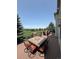 Outdoor deck featuring a dining table, chairs, and views of the golf course at 6323 S Sicily Way, Aurora, CO 80016