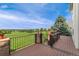 Spacious wooden deck overlooking lush green landscape, perfect for outdoor relaxation and entertainment at 6323 S Sicily Way, Aurora, CO 80016