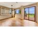 Inviting dining room with hardwood floors, modern lighting, and access to the outdoor deck at 6323 S Sicily Way, Aurora, CO 80016