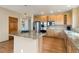 Well-appointed kitchen with stainless steel appliances, granite countertops, and wood cabinetry at 6323 S Sicily Way, Aurora, CO 80016