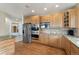 Bright kitchen with stainless steel appliances, granite countertops, and wooden cabinets at 6323 S Sicily Way, Aurora, CO 80016