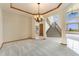 Elegant living space with an open layout and easy access to the staircase at 6323 S Sicily Way, Aurora, CO 80016