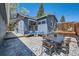 Backyard featuring patio seating, a covered section, and well-maintained landscaping at 2942 Chase St, Wheat Ridge, CO 80214