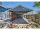 Covered carport with gray siding and ample space for parking and storage at 2942 Chase St, Wheat Ridge, CO 80214