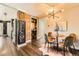 Charming dining area with modern lighting, a stylish table setting, and a unique decor; a warm and inviting space at 2942 Chase St, Wheat Ridge, CO 80214