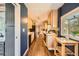 Galley-style kitchen with updated appliances, contrasting blue walls, and an open layout perfect for modern living at 2942 Chase St, Wheat Ridge, CO 80214