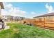 Grassy backyard featuring a privacy fence and outdoor grill at 23692 E 40Th Ave, Aurora, CO 80019