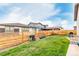 Landscaped backyard features lawn, retaining wall, and privacy fence at 23692 E 40Th Ave, Aurora, CO 80019