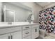 Bathroom with double vanity and geometric patterned shower curtain at 23692 E 40Th Ave, Aurora, CO 80019