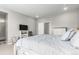 Spacious bedroom featuring neutral walls, carpet floors, and a large bed and dresser at 23692 E 40Th Ave, Aurora, CO 80019