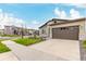 Charming single Gathering home featuring a two-car garage, stone accents, and manicured lawn at 23692 E 40Th Ave, Aurora, CO 80019