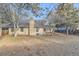 A view of the backyard showing trees and chimney of house at 5749 S Lansing Way, Englewood, CO 80111