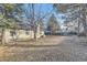Large backyard featuring mature trees and a well-maintained lawn at 5749 S Lansing Way, Englewood, CO 80111