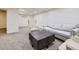 Finished basement with neutral carpet, modern furnishings, and ample space at 5749 S Lansing Way, Englewood, CO 80111