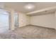Spacious basement area leading to a tiled bath at 5749 S Lansing Way, Englewood, CO 80111