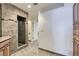 Bathroom featuring a glass shower, tile flooring, and wooden cabinets at 5749 S Lansing Way, Englewood, CO 80111