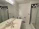 Clean bathroom features white tile, a shower, a bath, and a mirrored vanity with sink at 5749 S Lansing Way, Englewood, CO 80111