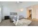 Bright bedroom featuring neutral decor and an ensuite bathroom at 5749 S Lansing Way, Englewood, CO 80111